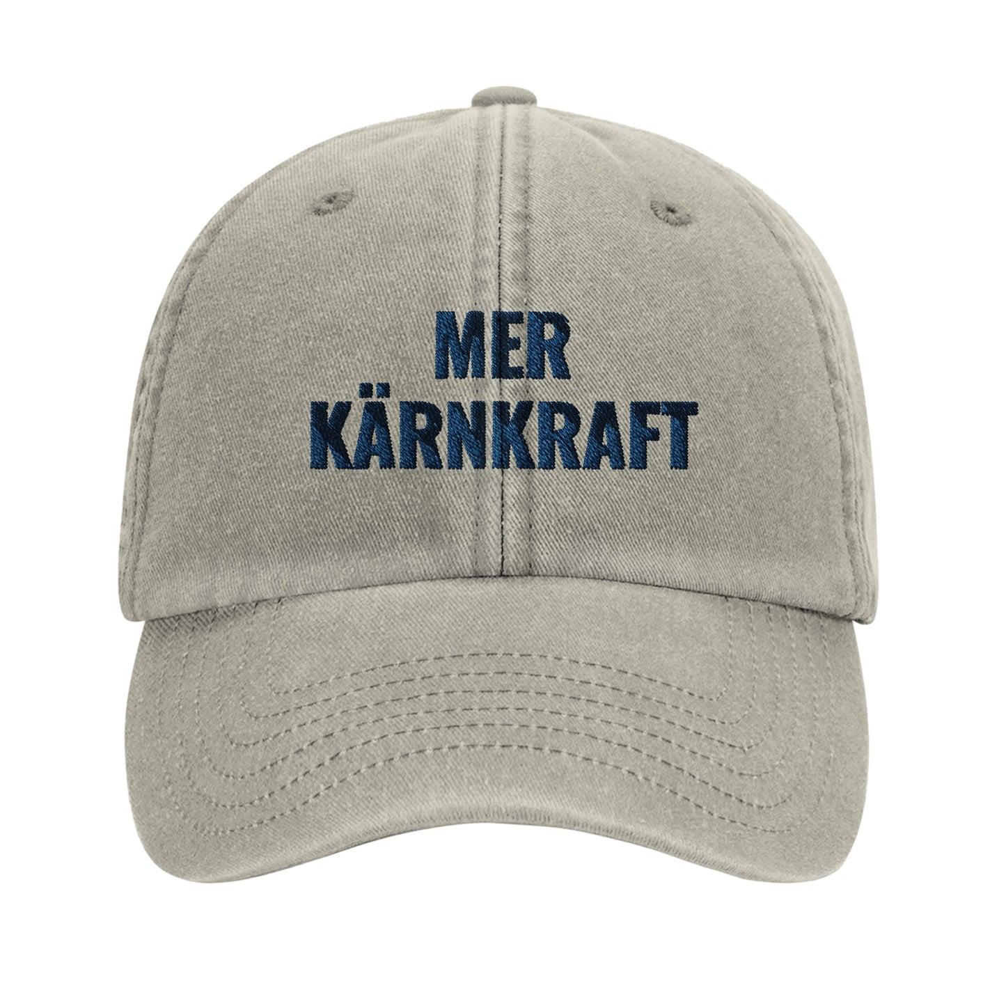 Beige vintagekeps i bomull med blå broderad text “Mer kärnkraft” från Nordbruk.